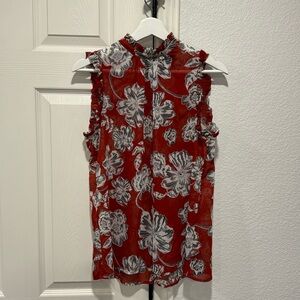 Rust colored sleeveless floral blouse